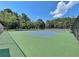 Community tennis court featuring a green and blue surface at 501 Bridlepath Ln, Peachtree City, GA 30269