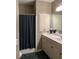 Clean bathroom with a shower-tub combo, vanity with storage, and neutral finishes at 605 Meadows Creek Dr, Johns Creek, GA 30005