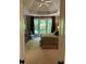 A tranquil main bedroom featuring a trey ceiling, neutral color palette, and a large window for ample natural light at 605 Meadows Creek Dr, Johns Creek, GA 30005