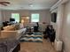 Large carpeted bedroom space including sitting area, workspace, and multiple windows at 6174 S. Skyline Dr, Douglasville, GA 30135