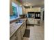 Bright kitchen with ample countertop space, light cabinetry, tile flooring, and modern appliances at 6174 S. Skyline Dr, Douglasville, GA 30135