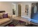 Inviting living room with modern decor and a view of the dining area through the doorway at 6174 S. Skyline Dr, Douglasville, GA 30135