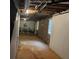Unfinished basement, shows block foundation, exposed ceiling and some windows at 1701 Charmeth Rd, Lithonia, GA 30058