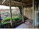Unfinished basement, shows dirt floor, water heater, wood beams and the home's foundation at 1701 Charmeth Rd, Lithonia, GA 30058