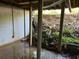 Unfinished basement space with concrete block walls and support beams at 1701 Charmeth Rd, Lithonia, GA 30058