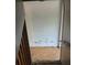 Stairway leading to the basement, showing concrete steps and a handrail at 1701 Charmeth Rd, Lithonia, GA 30058