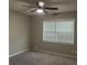 Bedroom with a window with blinds, ceiling fan, and neutral paint at 1701 Charmeth Rd, Lithonia, GA 30058