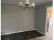 Dining room featuring dark hardwood floors and a classic chandelier at 1701 Charmeth Rd, Lithonia, GA 30058