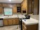Kitchen with wood cabinets, updated countertops and stainless steel appliances at 1701 Charmeth Rd, Lithonia, GA 30058
