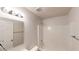 Bright bathroom featuring a shower and bath tub combo and a large mirror above the sink at 364 Springhaven Way, Lawrenceville, GA 30046