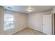 Cozy bedroom featuring carpet floors, a ceiling light and one large window at 364 Springhaven Way, Lawrenceville, GA 30046