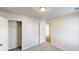 Bedroom featuring neutral carpet, standard ceiling light, closet and a door to another room at 364 Springhaven Way, Lawrenceville, GA 30046