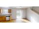 Eat-in kitchen featuring stainless steel appliances and sliding doors to the backyard at 364 Springhaven Way, Lawrenceville, GA 30046