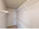 Bright walk-in closet featuring white walls and multiple metal shelving units for optimized storage at 364 Springhaven Way, Lawrenceville, GA 30046