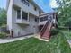 Exterior view features a large yard, house exterior, stairs, a screened in porch and beautiful greenery at 4271 Edgewater Drive Northwest Nw Dr, Kennesaw, GA 30144