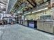 Unfinished basement workshop area with concrete floor, shelving, and workbench at 4271 Edgewater Drive Northwest Nw Dr, Kennesaw, GA 30144