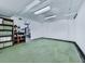 Spacious unfinished basement with large open area, drop ceiling, and shelving at 4271 Edgewater Drive Northwest Nw Dr, Kennesaw, GA 30144