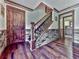Hallway with wooden door, staircase and leading to the kitchen at 4271 Edgewater Drive Northwest Nw Dr, Kennesaw, GA 30144