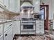 Bright kitchen featuring stainless steel appliances and a large stainless steel range at 4271 Edgewater Drive Northwest Nw Dr, Kennesaw, GA 30144