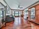 Cozy living room with hardwood floors, a ceiling fan, and an antique armoire at 4271 Edgewater Drive Northwest Nw Dr, Kennesaw, GA 30144