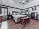Spacious primary bedroom with ceiling fan, hardwood floors, and dresser at 4271 Edgewater Drive Northwest Nw Dr, Kennesaw, GA 30144
