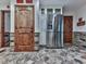 Pantry with stainless steel refrigerator, tiled floor, and wooden doors at 4271 Edgewater Drive Northwest Nw Dr, Kennesaw, GA 30144