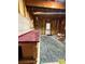 Unfinished basement with exposed framing, a work bench, a rug, and an exit door at 4715 Scotney Ct, Suwanee, GA 30024