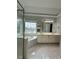 Bright bathroom featuring a tiled floor, shower, corner tub, and a double sink vanity at 4715 Scotney Ct, Suwanee, GA 30024