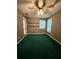 Bedroom featuring green carpet, neutral paint, and a ceiling fan at 4715 Scotney Ct, Suwanee, GA 30024