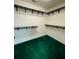 A spacious walk-in closet with carpet, shelving and hanging rods at 4715 Scotney Ct, Suwanee, GA 30024