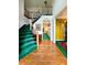 Grand foyer featuring hardwood floors, staircase with a wooden railing, and high ceilings at 4715 Scotney Ct, Suwanee, GA 30024