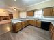 Well-appointed kitchen with stone countertops, oak cabinets, modern appliances, and an open layout at 5005 Johns Creek Ct, Alpharetta, GA 30022