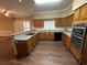 Modern kitchen with granite countertops, updated appliances, and ample cabinet space at 5005 Johns Creek Ct, Alpharetta, GA 30022