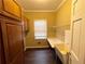 Functional laundry room with built-in cabinets, utility sink, and countertop space at 5005 Johns Creek Ct, Alpharetta, GA 30022