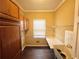 Functional laundry room with built-in cabinets, sink, and ample counter space at 5005 Johns Creek Ct, Alpharetta, GA 30022