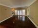 Bright living room featuring hardwood floors, neutral wall color, and natural light at 5005 Johns Creek Ct, Alpharetta, GA 30022