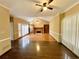 Spacious living room with a fireplace and built-in bookshelves, creating a cozy and inviting atmosphere at 5005 Johns Creek Ct, Alpharetta, GA 30022