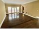 Living room features hardwood floors and access to an outdoor deck at 5005 Johns Creek Ct, Alpharetta, GA 30022