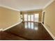 Living room features hardwood floors and access to an outdoor deck at 5005 Johns Creek Ct, Alpharetta, GA 30022