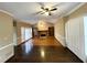 Cozy living room with a brick fireplace and built-in bookshelves at 5005 Johns Creek Ct, Alpharetta, GA 30022