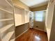Organized walk-in closet with custom shelving and ample storage space, offering functionality and style at 5005 Johns Creek Ct, Alpharetta, GA 30022