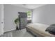 Neutral bedroom featuring a cozy bed, ample storage, and soft natural light at 8690 Cedar Creek Rdg, Riverdale, GA 30274