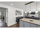 Open kitchen featuring an island, gray cabinets, and stainless steel appliances at 8690 Cedar Creek Rdg, Riverdale, GA 30274