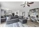 Open-concept living room featuring modern gray finishes and plush, oversized seating at 8690 Cedar Creek Rdg, Riverdale, GA 30274