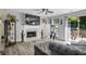 Bright living room with fireplace, deck access, and modern decor and finishes at 8690 Cedar Creek Rdg, Riverdale, GA 30274