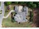 Aerial view showcases the large house with manicured lawns and meticulous landscaping at 9695 Almaviva Dr, Alpharetta, GA 30022