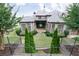 Stunning brick home with lush landscaping, mature trees, and a well-maintained lawn at 9695 Almaviva Dr, Alpharetta, GA 30022