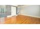 Bedroom featuring hardwood floors, neutral walls, and white trim at 9695 Almaviva Dr, Alpharetta, GA 30022