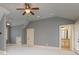 Primary bedroom featuring ensuite bathroom access and large windows at 9695 Almaviva Dr, Alpharetta, GA 30022