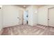 Spacious bedroom featuring neutral carpet, recessed lighting, and an ensuite bathroom at 9695 Almaviva Dr, Alpharetta, GA 30022